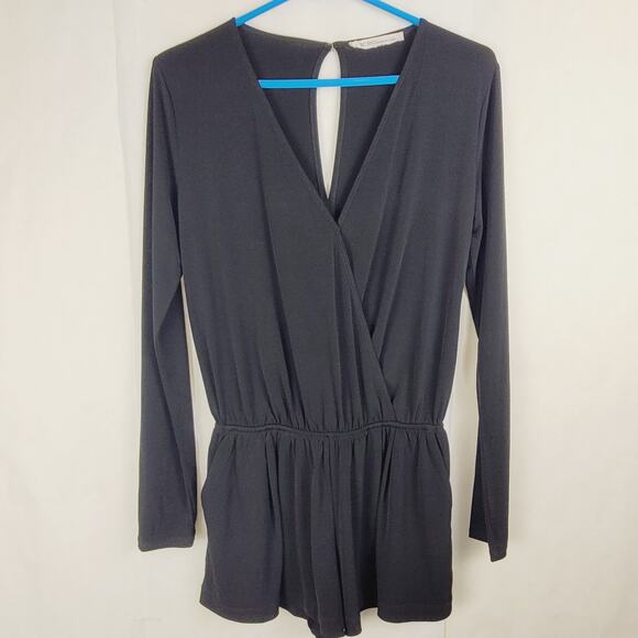 BCBGeneration black vneck long sleeved romper Size small pockets Goth Staple - Picture 1 of 9